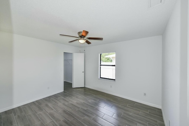 1168 SE Clifton Ln, Port Saint Lucie, FL 34983 - unfurnished room featuring a ceiling fan, baseboards, and wood tiled floors