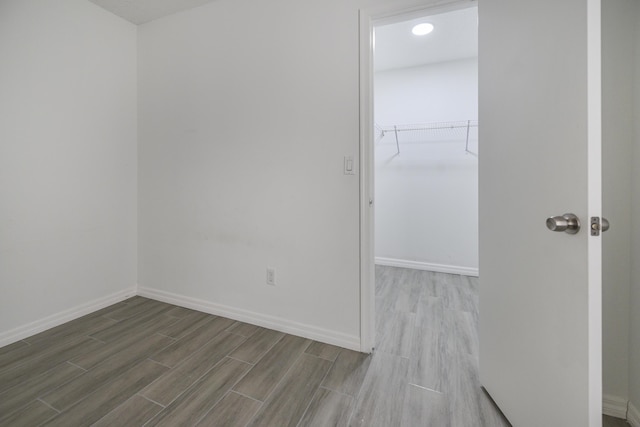 1168 SE Clifton Ln, Port Saint Lucie, FL 34983 - spare room featuring wood finished floors and baseboards
