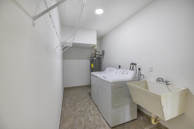 1168 SE Clifton Ln, Port Saint Lucie, FL 34983 - clothes washing area with independent washer and dryer, electric water heater, and baseboards