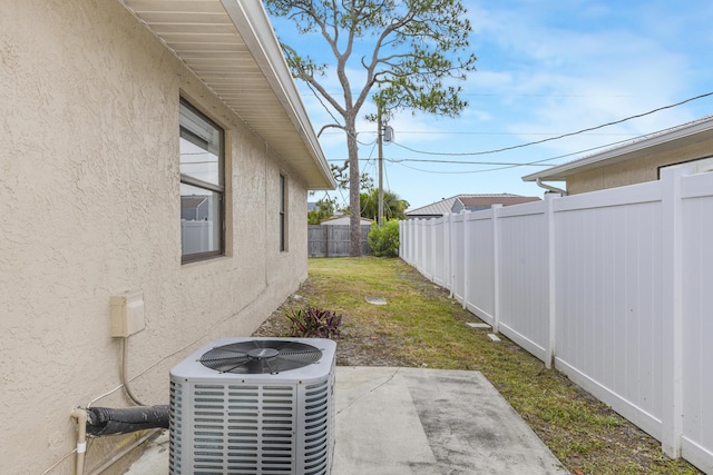 1168 SE Clifton Ln, Port Saint Lucie, FL 34983 - unfurnished living room featuring ceiling fan, baseboards, and dark wood finished floors