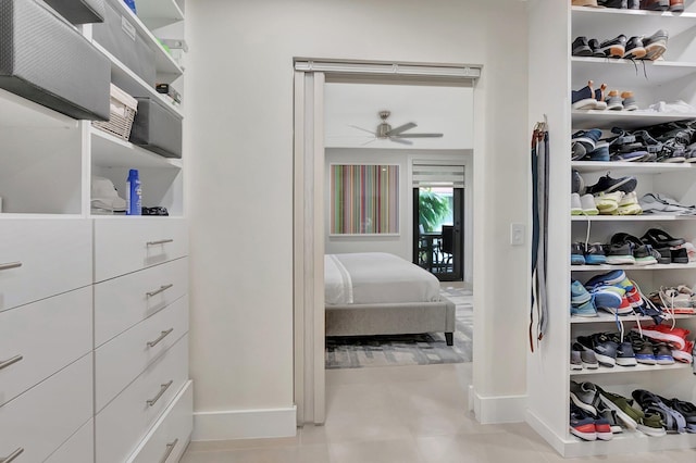 spacious closet featuring ceiling fan