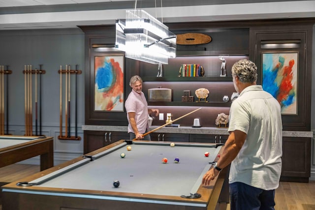 playroom with wood finished floors and pool table