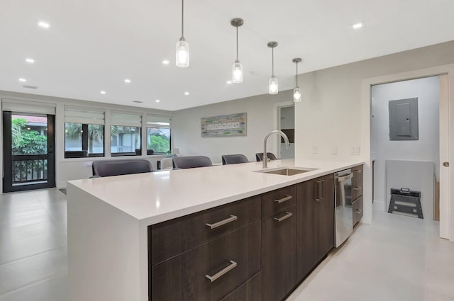 kitchen with electric panel, light countertops, a sink, modern cabinets, and dark brown cabinets