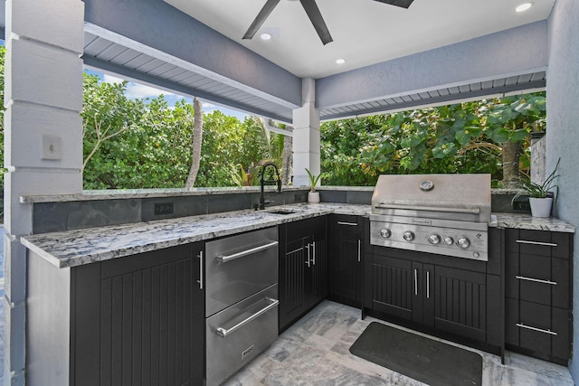 view of patio featuring a grill, area for grilling, and a sink