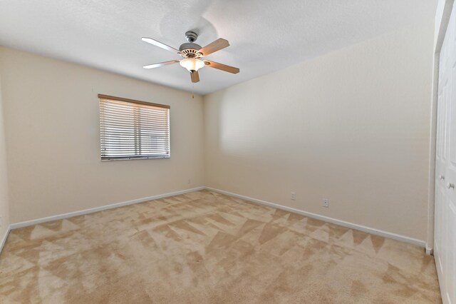 3119 N Evergreen Cir, Boynton Beach, FL 33426 - empty room featuring light colored carpet, ceiling fan, and baseboards