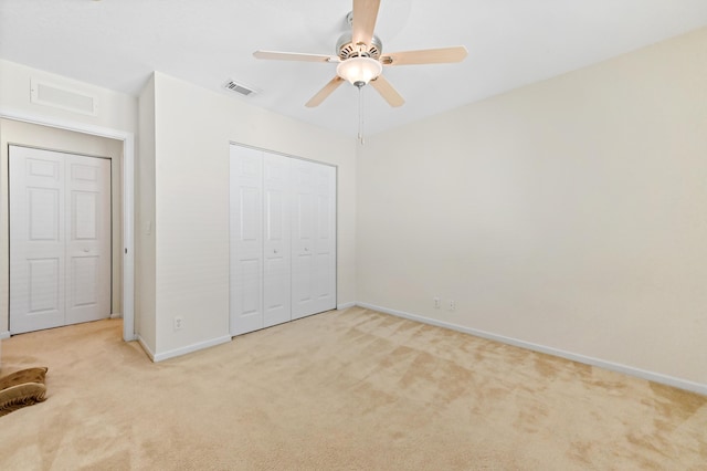 3119 N Evergreen Cir, Boynton Beach, FL 33426 - unfurnished bedroom with light carpet, baseboards, a closet, and a ceiling fan