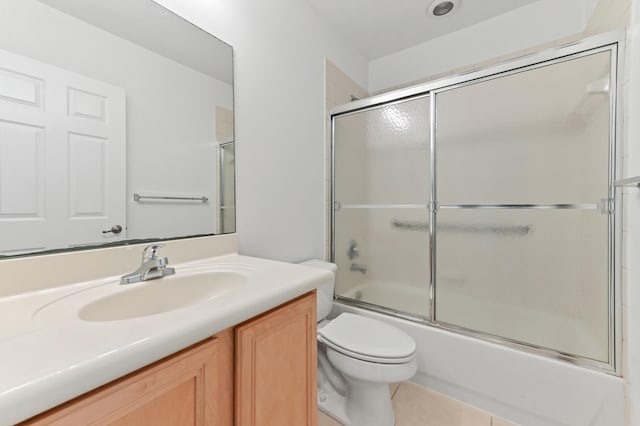 3119 N Evergreen Cir, Boynton Beach, FL 33426 - bathroom featuring toilet, vanity, combined bath / shower with glass door, and tile patterned flooring