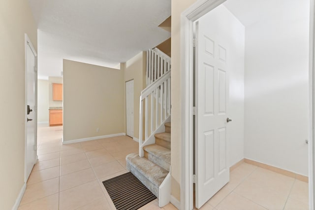 3119 N Evergreen Cir, Boynton Beach, FL 33426 - stairway featuring tile patterned floors and baseboards