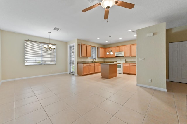 3119 N Evergreen Cir, Boynton Beach, FL 33426 - kitchen featuring white appliances, baseboards, a sink, a chandelier, and open floor plan