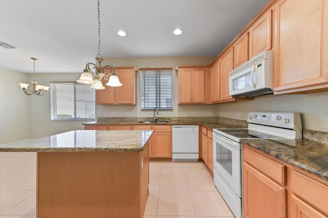 3119 N Evergreen Cir, Boynton Beach, FL 33426 - kitchen featuring white appliances, a chandelier, a sink, light brown cabinetry, and a kitchen island