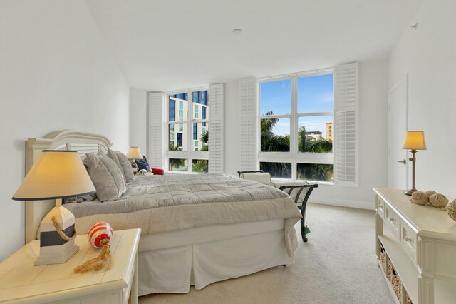 bedroom featuring light carpet
