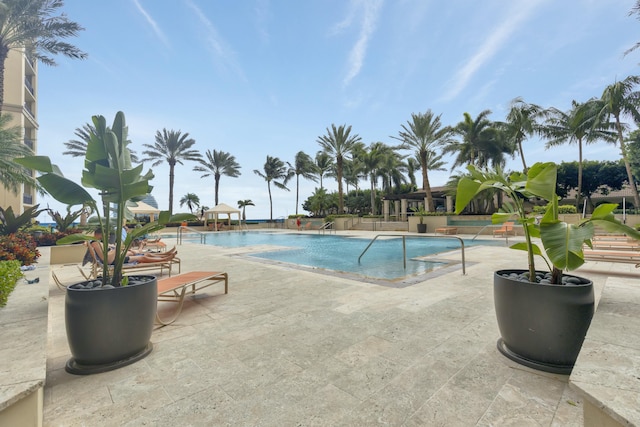 community pool featuring a patio area