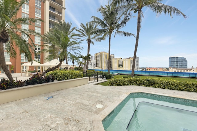 view of swimming pool featuring a view of city