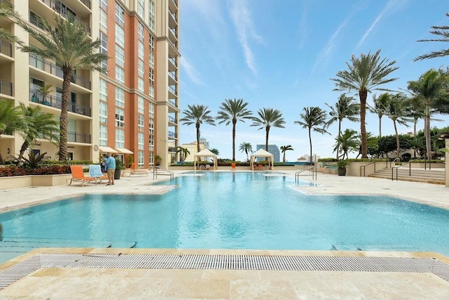 community pool with a patio area