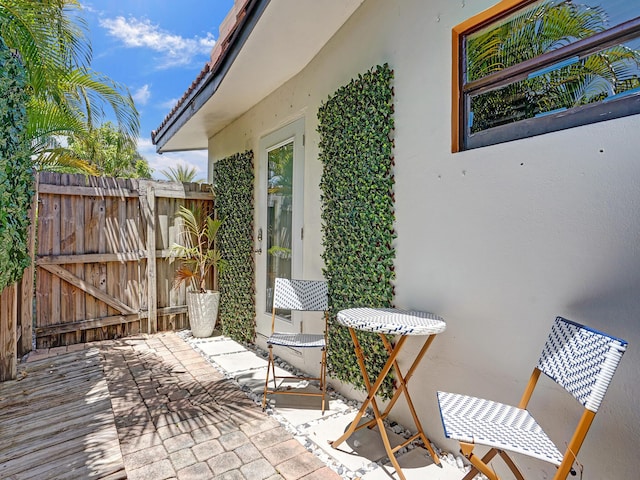 view of patio featuring a gate and fence