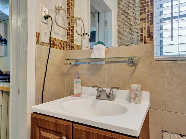 bathroom with tile walls and vanity