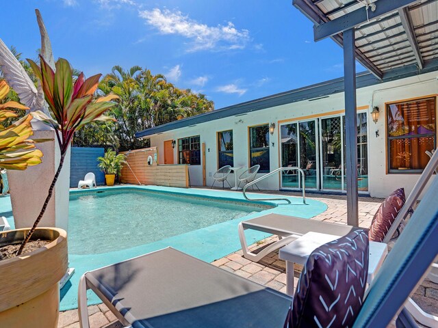 view of pool featuring a fenced in pool, fence, and a patio