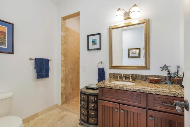702 SE 7th St, Delray Beach, FL 33483 - bathroom with toilet, tiled shower, marble finish floors, vanity, and baseboards