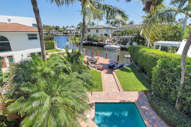 702 SE 7th St, Delray Beach, FL 33483 - outdoor pool featuring a boat dock, a water view, and a lawn