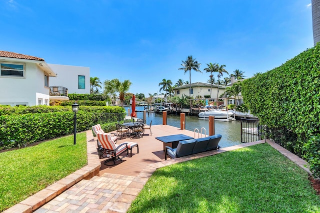 702 SE 7th St, Delray Beach, FL 33483 - dock area featuring a water view and a lawn