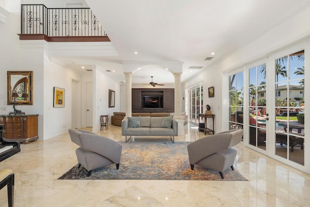 702 SE 7th St, Delray Beach, FL 33483 - living room with decorative columns, marble tiled floors, crown molding, recessed lighting, and a ceiling fan