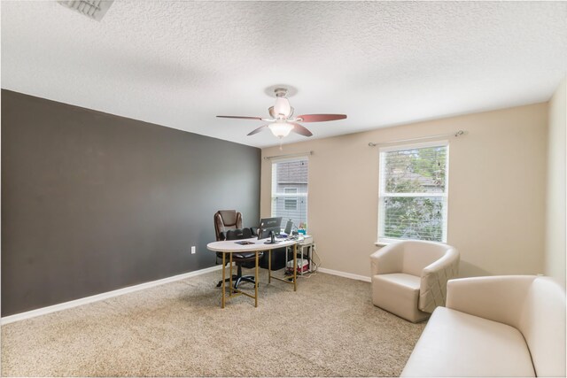 6102 NW Painted Bunting Ct, Port Saint Lucie, FL 34986 - carpeted office with baseboards, visible vents, ceiling fan, and a textured ceiling