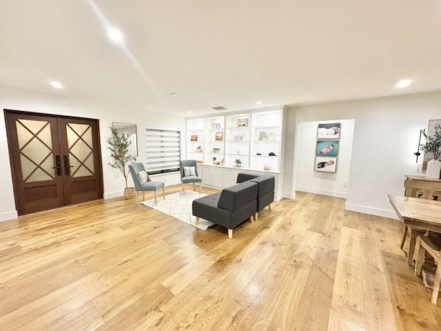 9600 Payton Ct, Boynton Beach, FL 33472 - living area featuring light wood-style flooring, french doors, and recessed lighting