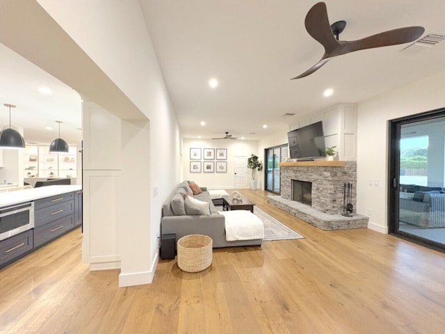 9600 Payton Ct, Boynton Beach, FL 33472 - living area with ceiling fan, light wood-type flooring, a fireplace, baseboards, and recessed lighting