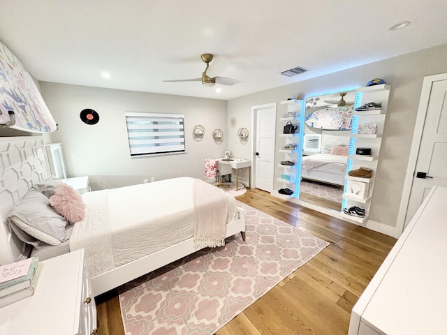 9600 Payton Ct, Boynton Beach, FL 33472 - bedroom with wood finished floors, a ceiling fan, and recessed lighting