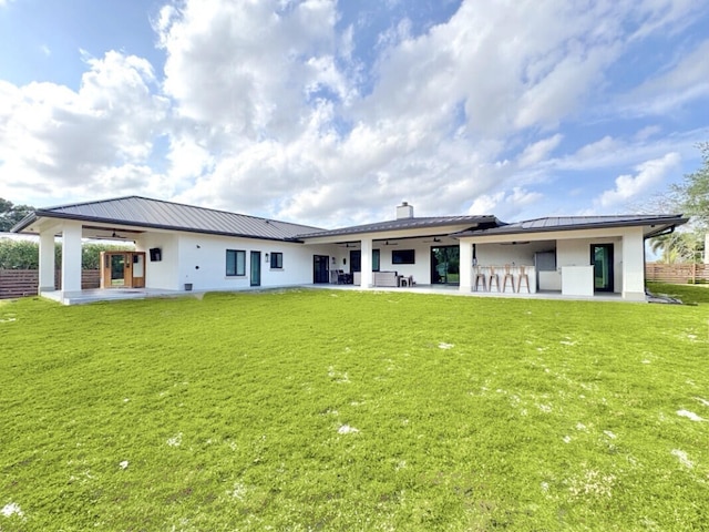9600 Payton Ct, Boynton Beach, FL 33472 - rear view of property featuring a standing seam roof, a patio area, ceiling fan, and metal roof