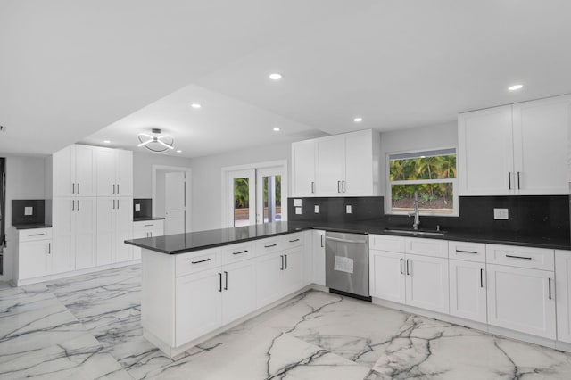 6008 S Citrus Ave, Fort Pierce, FL 34982 - kitchen featuring stainless steel dishwasher, a peninsula, recessed lighting, light marble finish floors, and tasteful backsplash
