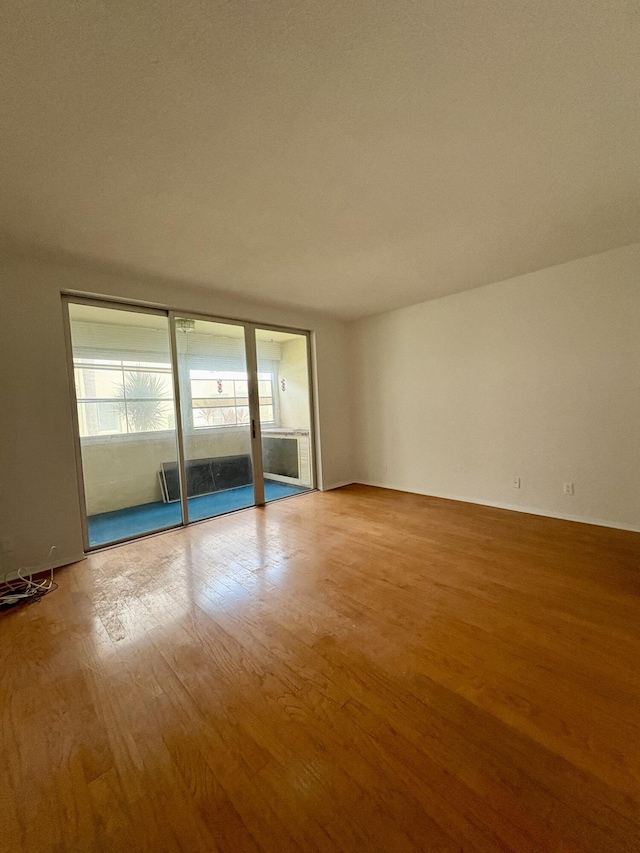 2540 Boundbrook Blvd Unit 110, Palm Springs, FL 33406 - unfurnished room with wood finished floors