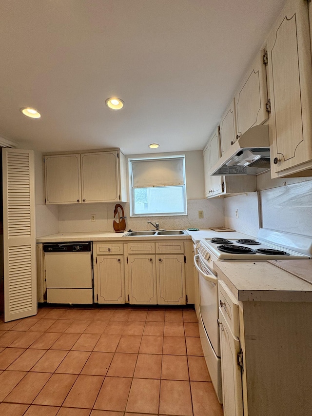 2540 Boundbrook Blvd Unit 110, Palm Springs, FL 33406 - kitchen featuring white appliances, under cabinet range hood, light countertops, light tile patterned floors, and recessed lighting