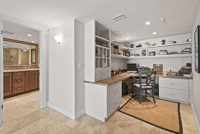 office space featuring baseboards, built in study area, visible vents, and recessed lighting
