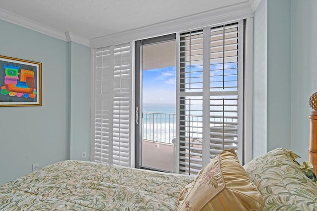 bedroom with a water view, access to outside, and crown molding