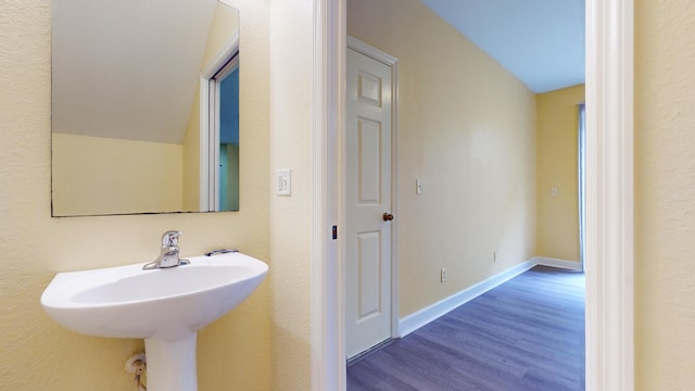 2558 SE Pineland Dr, Port Saint Lucie, FL 34952 - bathroom with wood finished floors and baseboards
