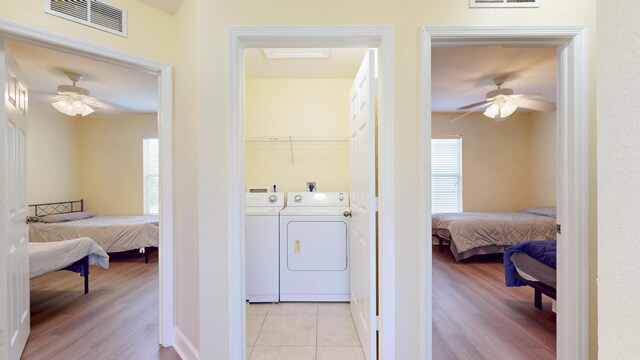 2558 SE Pineland Dr, Port Saint Lucie, FL 34952 - laundry room with visible vents, washing machine and clothes dryer, a ceiling fan, and laundry area