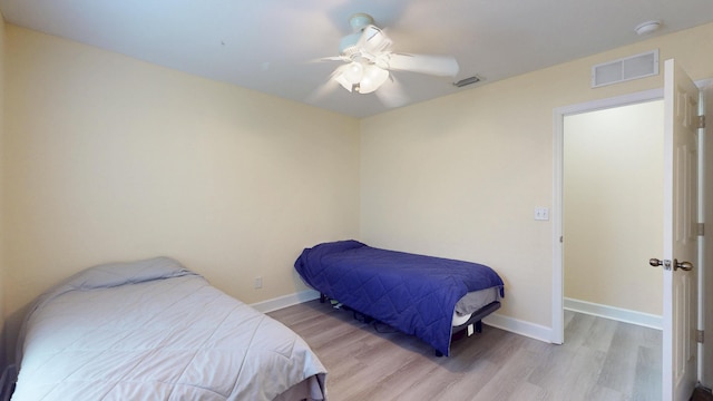 2558 SE Pineland Dr, Port Saint Lucie, FL 34952 - bedroom featuring visible vents, baseboards, a ceiling fan, and wood finished floors