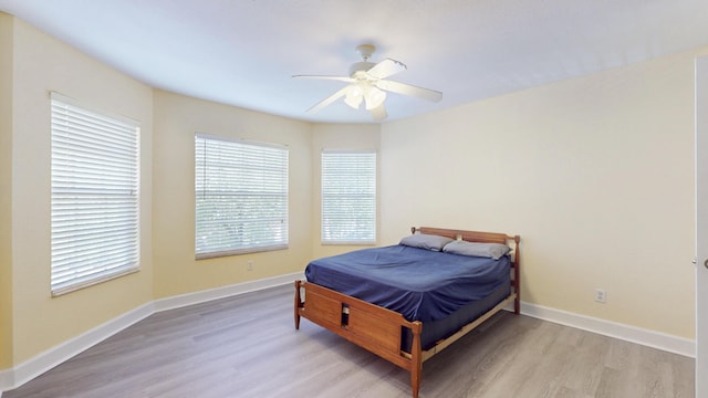 2558 SE Pineland Dr, Port Saint Lucie, FL 34952 - bedroom featuring baseboards, a ceiling fan, and wood finished floors