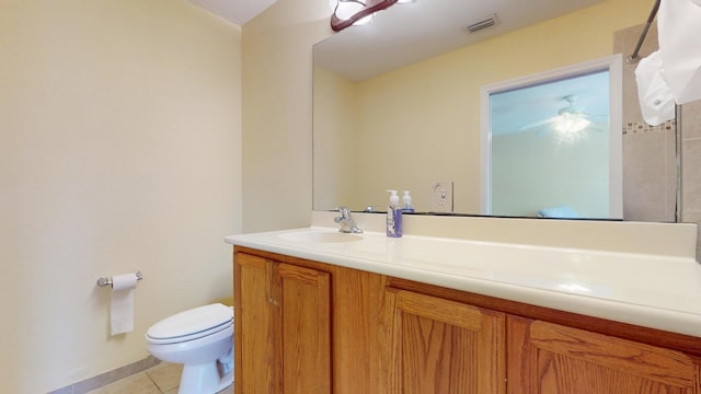2558 SE Pineland Dr, Port Saint Lucie, FL 34952 - bathroom featuring visible vents, baseboards, toilet, vanity, and tile patterned flooring