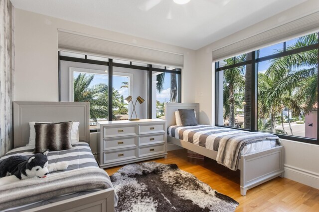 bedroom with light wood-style floors and ceiling fan
