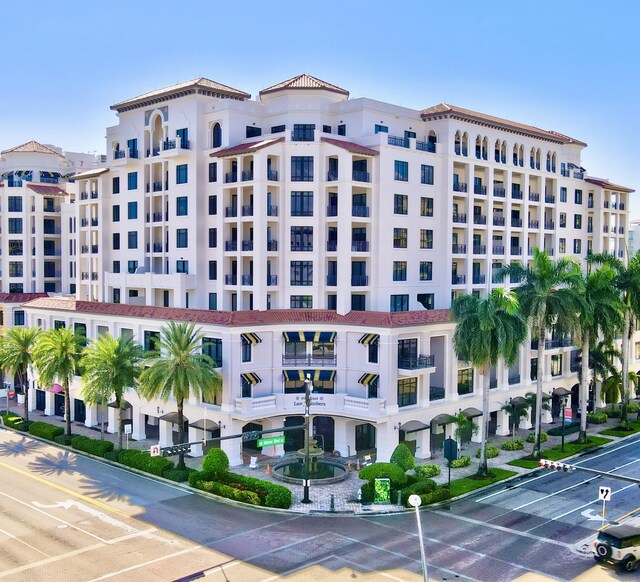 view of property featuring uncovered parking