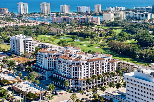 bird's eye view featuring a water view and golf course view