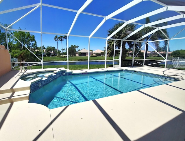 10902 SW Blue Mesa Way, Port Saint Lucie, FL 34987 - view of pool featuring a patio area, a water view, a pool with connected hot tub, and a lanai