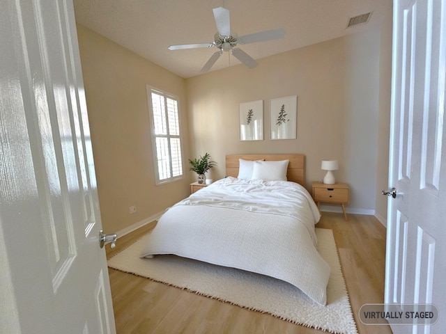 10902 SW Blue Mesa Way, Port Saint Lucie, FL 34987 - bedroom featuring wood finished floors and a ceiling fan