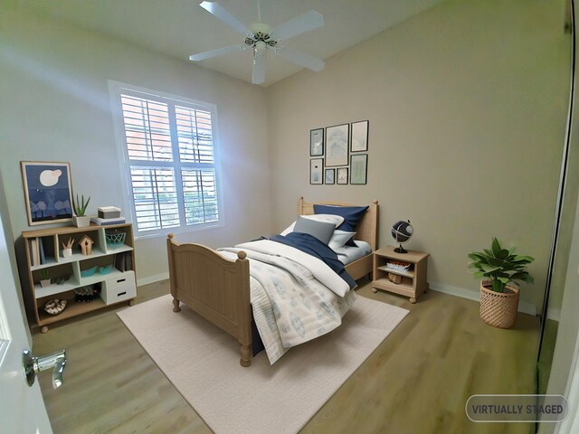 10902 SW Blue Mesa Way, Port Saint Lucie, FL 34987 - bedroom with wood finished floors and a ceiling fan