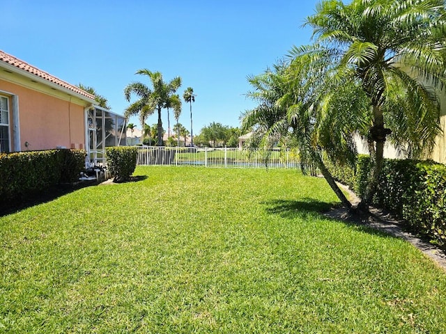 10902 SW Blue Mesa Way, Port Saint Lucie, FL 34987 - view of yard featuring a water view and a lanai