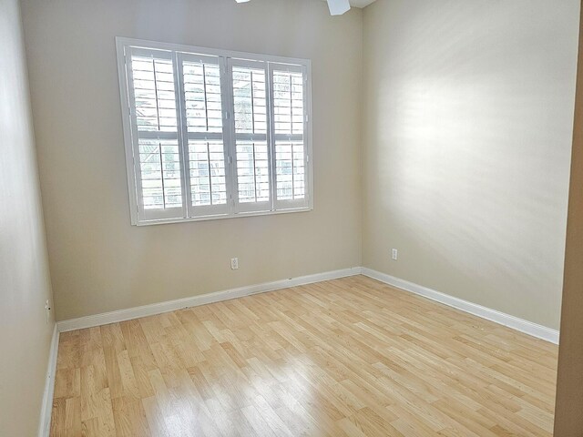 10902 SW Blue Mesa Way, Port Saint Lucie, FL 34987 - empty room featuring wood finished floors and baseboards