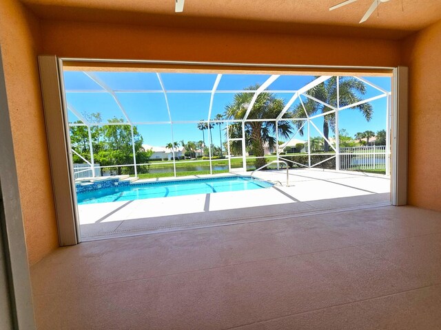 10902 SW Blue Mesa Way, Port Saint Lucie, FL 34987 - view of swimming pool featuring ceiling fan, a patio area, a pool with connected hot tub, and a lanai