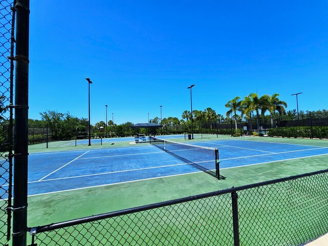 10902 SW Blue Mesa Way, Port Saint Lucie, FL 34987 - view of tennis court with community basketball court